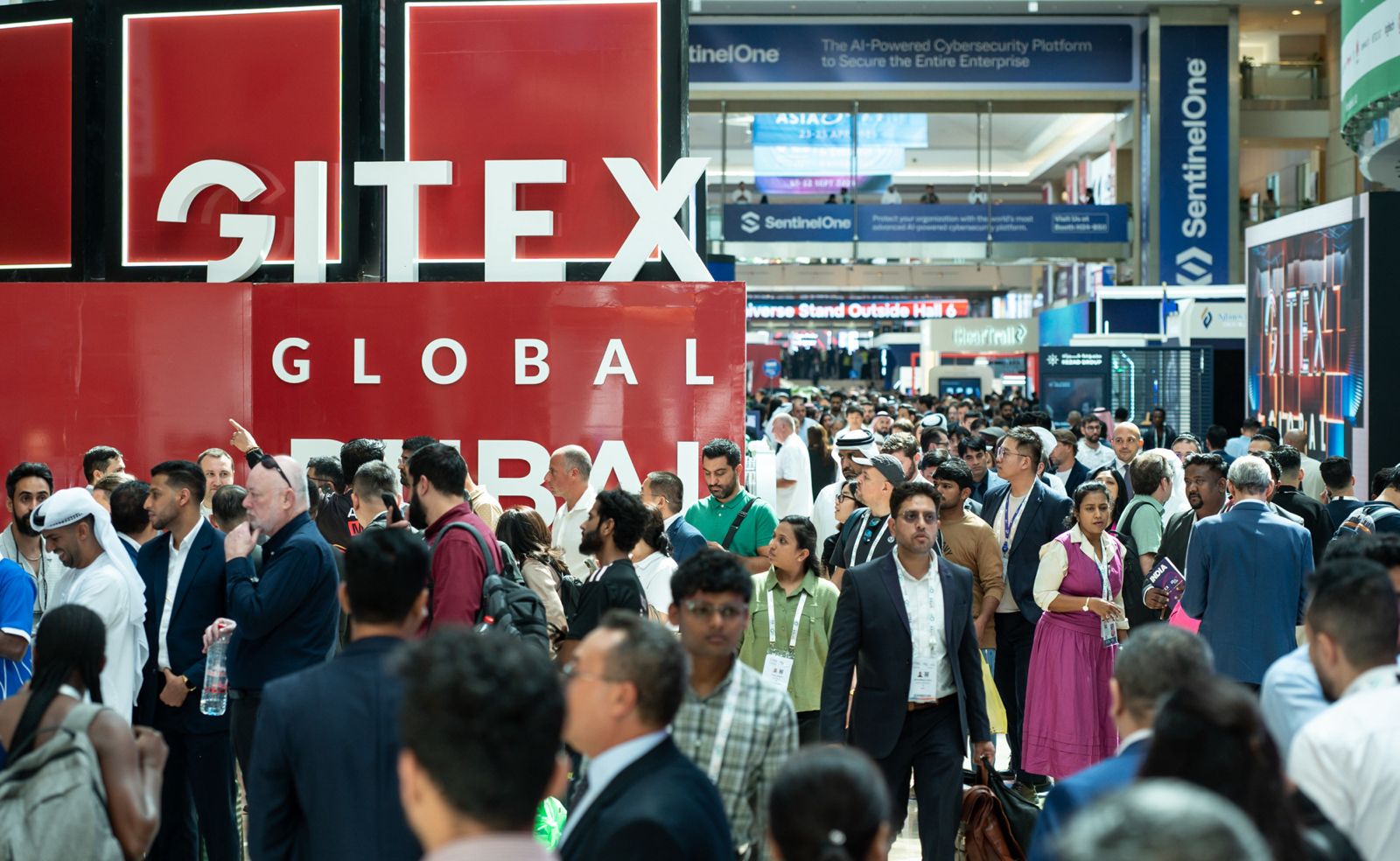 Visitors under the GITEX Global signage in Dubai