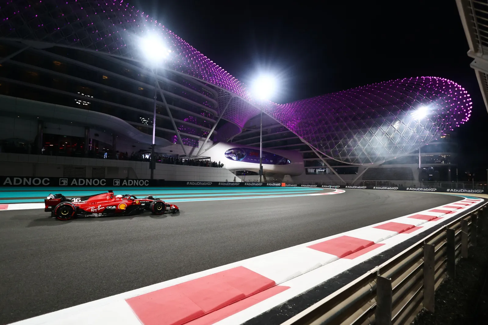 A Formula 1 car at Yas Marina Circuit under floodlights during a previous Abu Dhabi Grand Prix