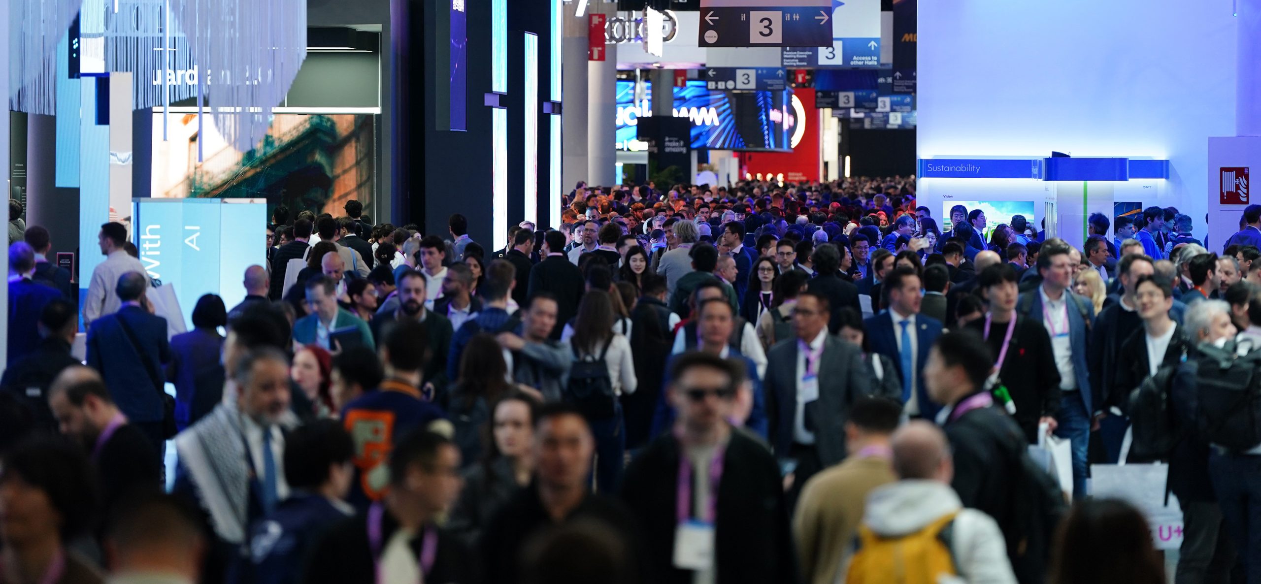 A crowded aisle between halls at MWC Barcelona