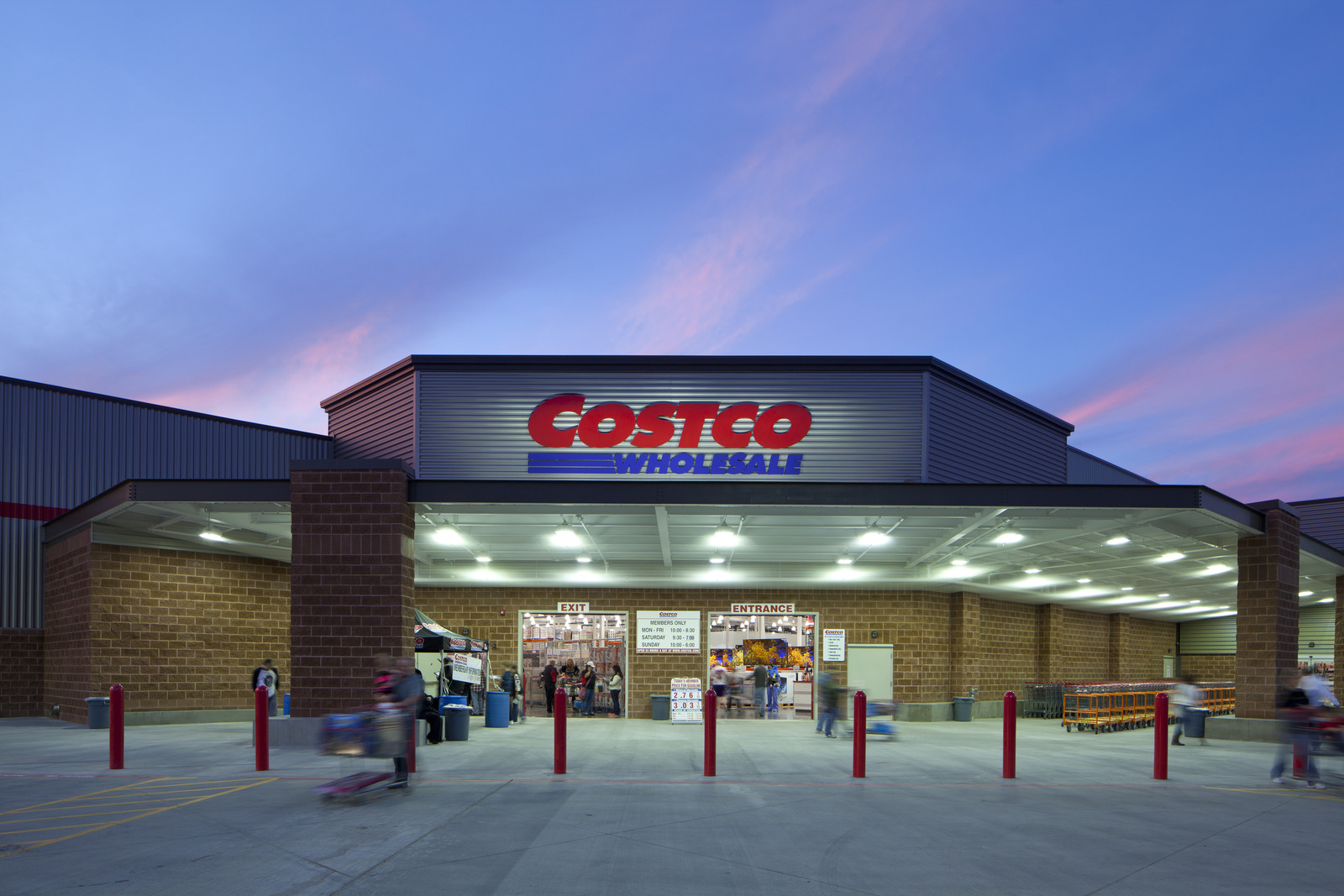 A Costco Wholesale storefront at dusk